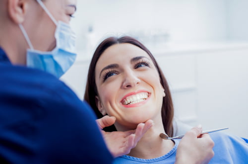 Dentist discussing dental treatment and the Canadian Dental Care Plan (CDCP) with a patient at a dental clinic in Vaughan