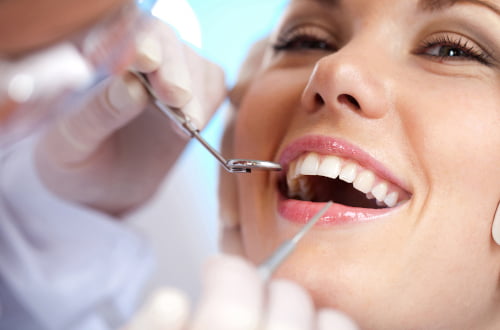Dentist providing restorative dental care during a treatment appointment in a dental clinic in Vaughan