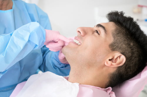 Dentist performing non-surgical gum therapy in a modern dental clinic in Vaughan