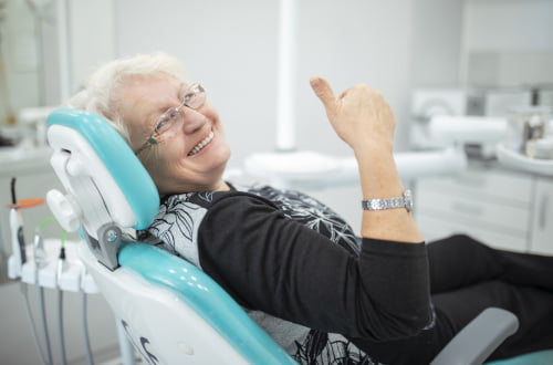 Senior patient sitting in a dental chair during a prosthodontic consultation for dentures at a dental clinic in Vaughan